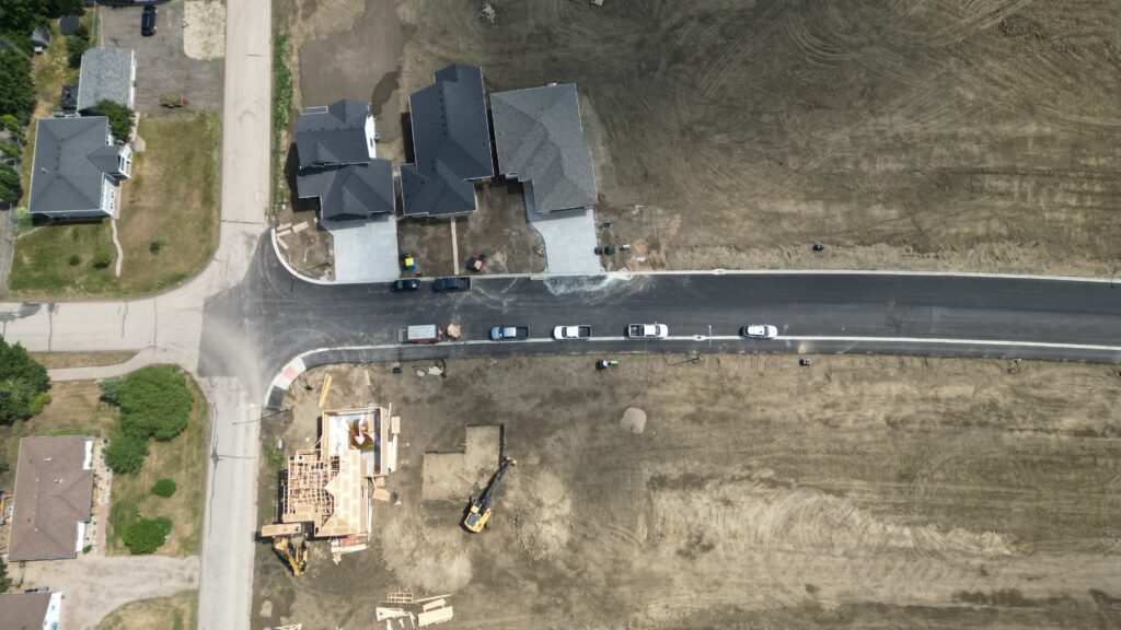 Over head of homes built by Trademark homes, Munro Homes, and Gilroy Home at The Country in Lumsden